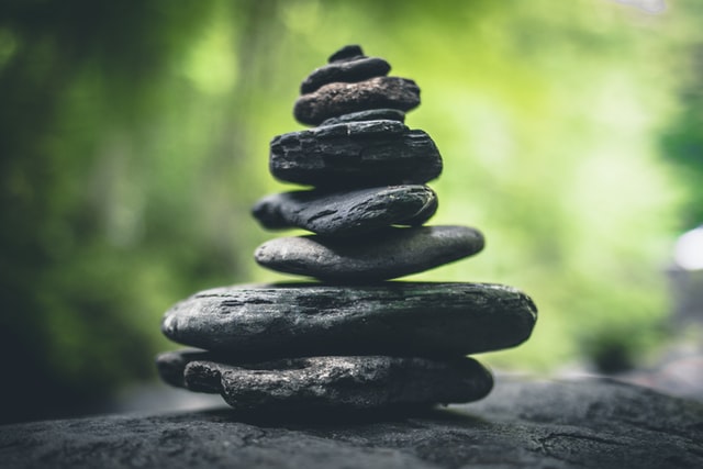 a stack of rocks sitting on top of a rock.